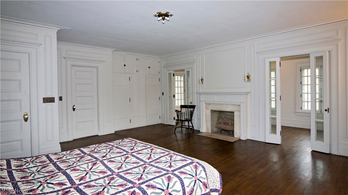 2636 East Overlook Road Cleveland, OH 44106 - Photo 16 of 24 A huge Master Suite includes hers and hers (oh, and his) walk-in closets, hardwood floors and fireplace, and is completed by a quiet, well-heated Sun Porch fronted by folding French doors