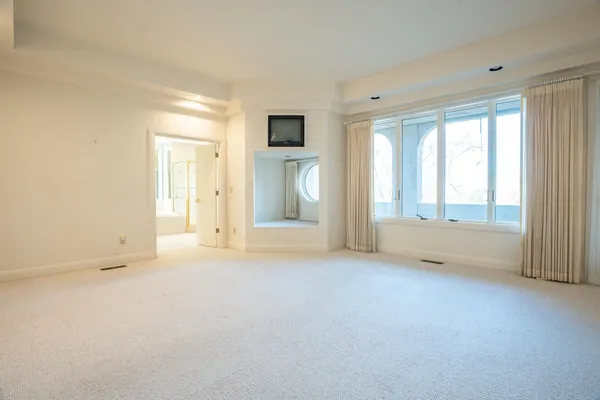 wooden floor and window in an empty room