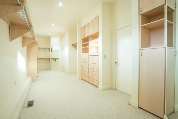 a view of empty room with a bathroom