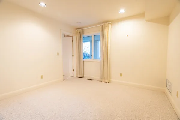 an empty room with window