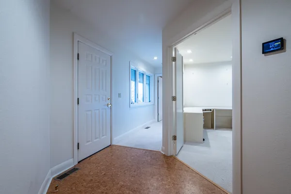a view of a livingroom with wooden floor