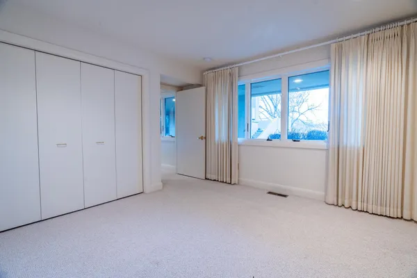 an empty room with a bathroom