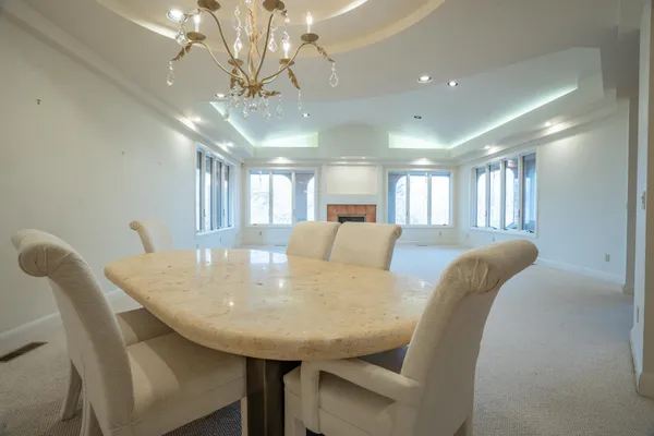 a view of a dining room with furniture and window