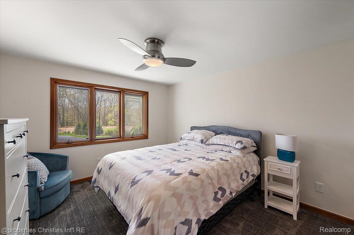 1071 Woodbridge Lane Rochester, MI 48306 - Photo 35 of 76 Bedroom with ceiling fan and dark colored carpet