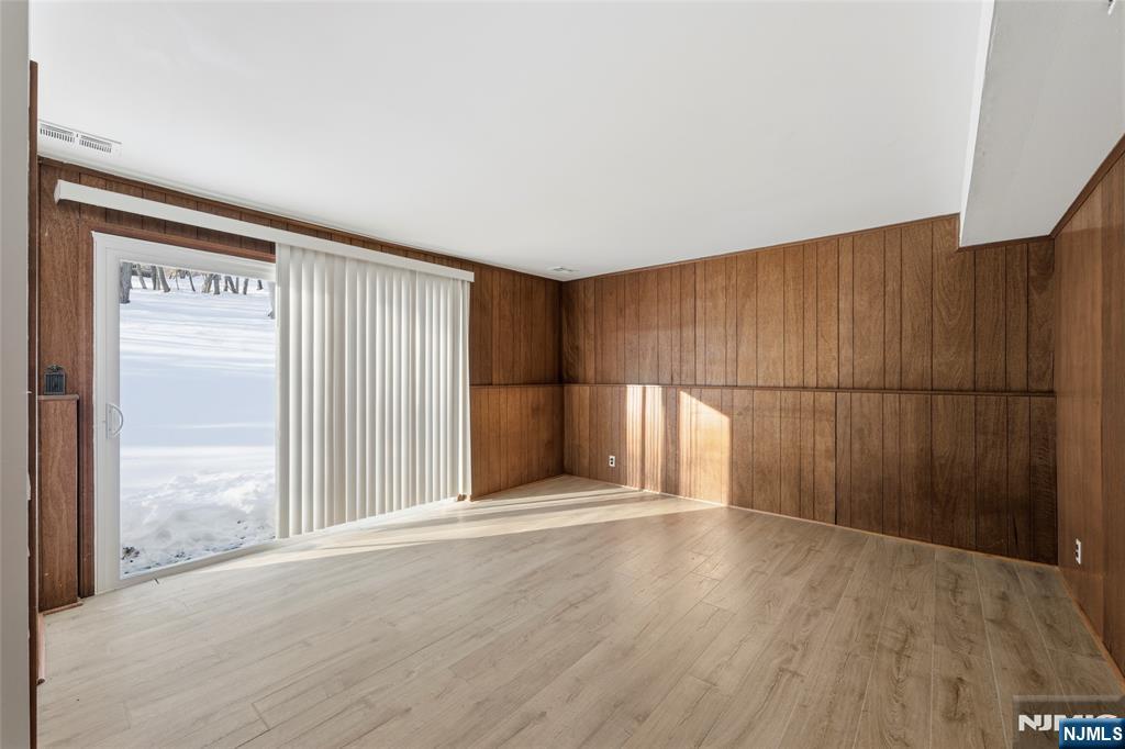 6 Brookside Avenue Hackettstown, NJ 07840 - Photo 17 of 36 an empty room with wooden floor and windows