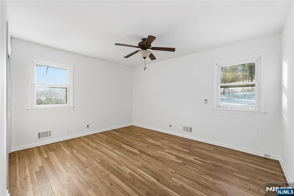 6 Brookside Avenue Hackettstown, NJ 07840 - Photo 23 of 36 a view of empty room with wooden floor and fan