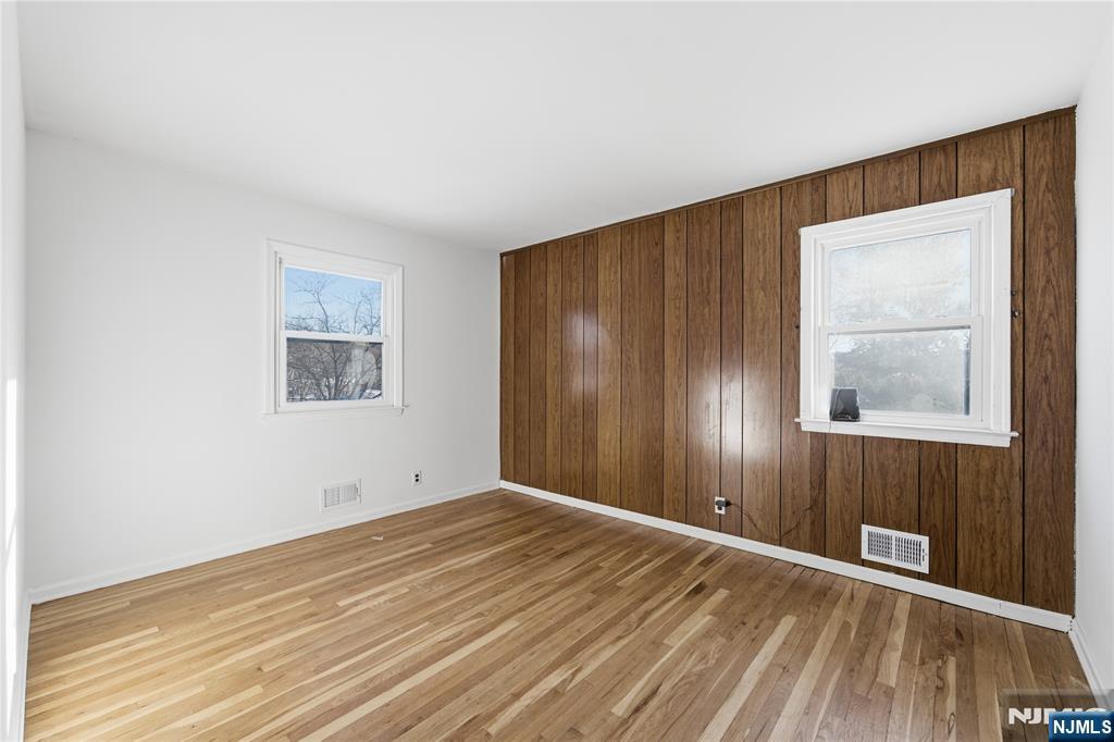 6 Brookside Avenue Hackettstown, NJ 07840 - Photo 33 of 36 an empty room with wooden floor and windows