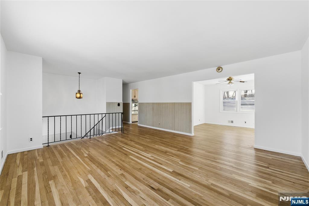 6 Brookside Avenue Hackettstown, NJ 07840 - Photo 4 of 36 a view of a big room with wooden floor and windows