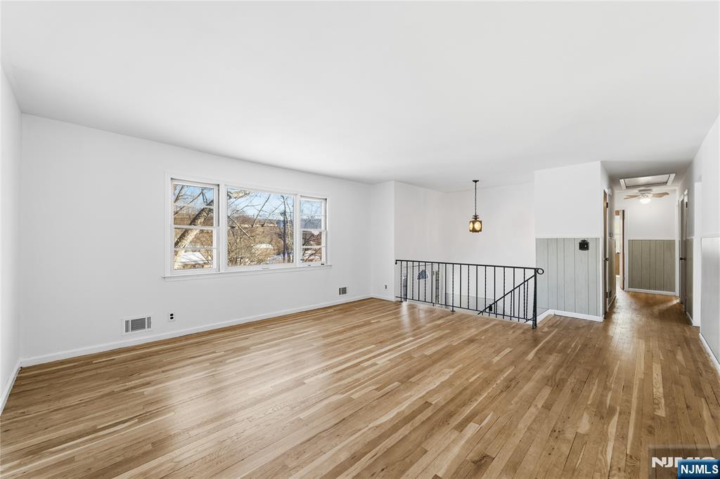6 Brookside Avenue Hackettstown, NJ 07840 - Photo 5 of 36 a view of an empty room with wooden floor and a window