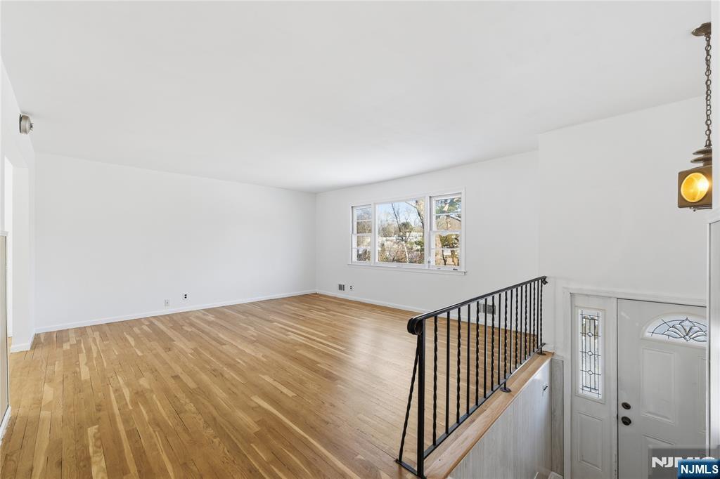 6 Brookside Avenue Hackettstown, NJ 07840 - Photo 6 of 36 a view of a hallway with wooden floor