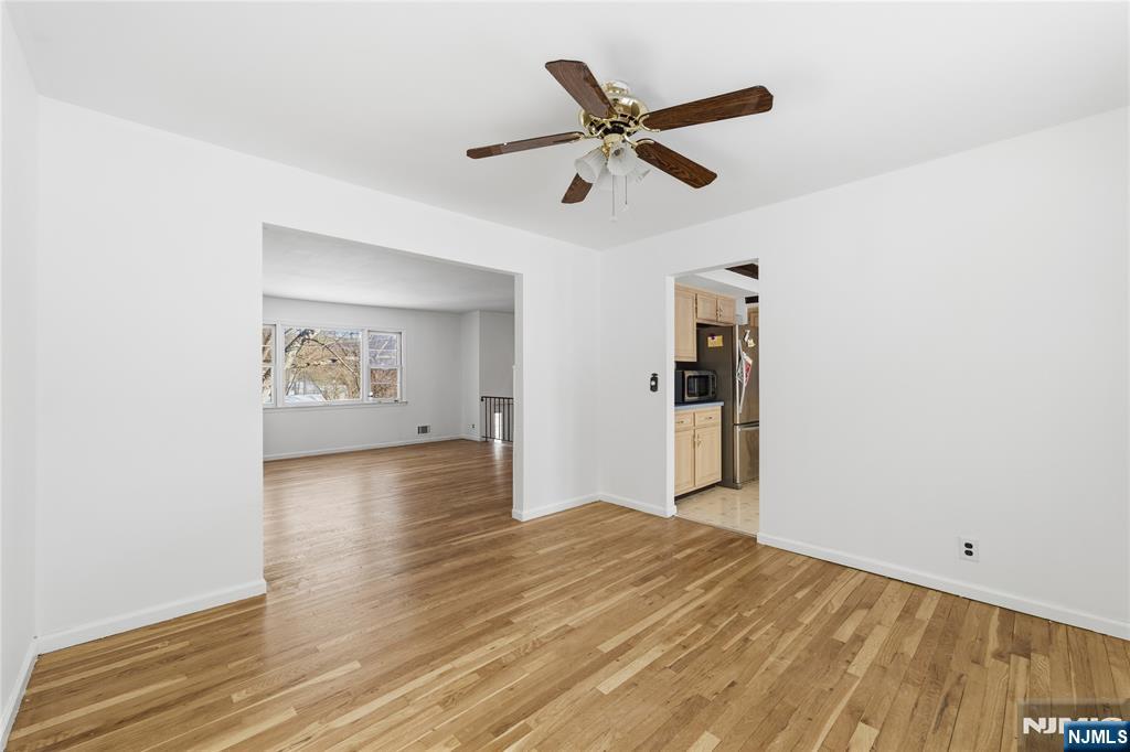 6 Brookside Avenue Hackettstown, NJ 07840 - Photo 9 of 36 a view of a big room with wooden floor and windows