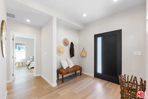 a view of room with furniture and wooden floor