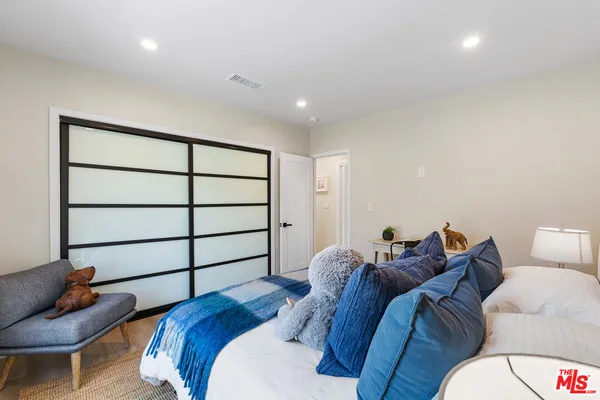 a bed room with a bed and a couch