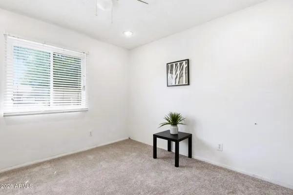 a view of work space with a window and a potted plant