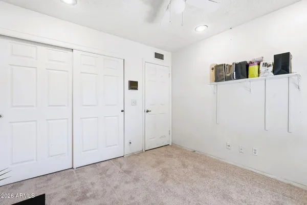 a view of a livingroom with wooden cabinets