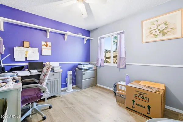 a bedroom with a workspace