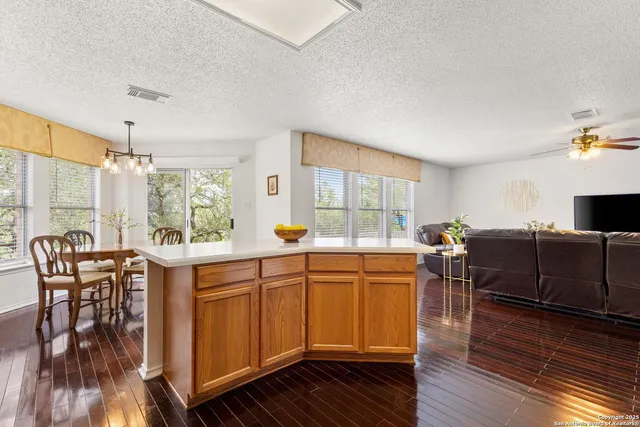 a kitchen with lots of counter top space and dining table