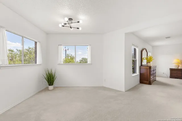 a view of a room with window and wooden floor
