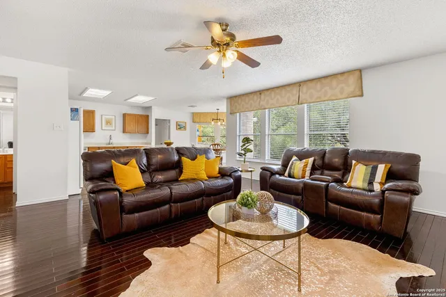 a living room with furniture and a large window