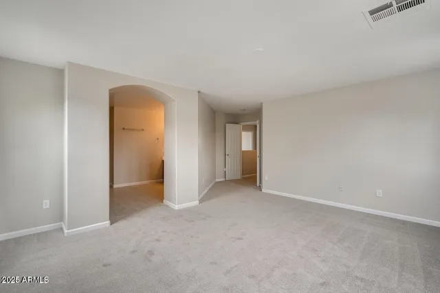 an empty room with closet area