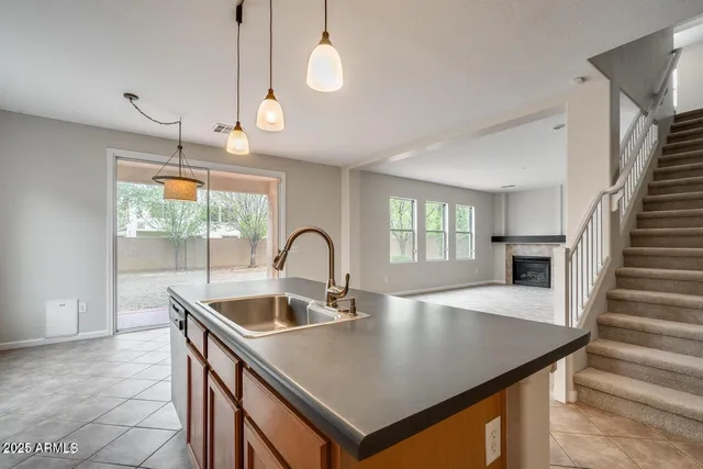 a kitchen with counter space and wooden floor
