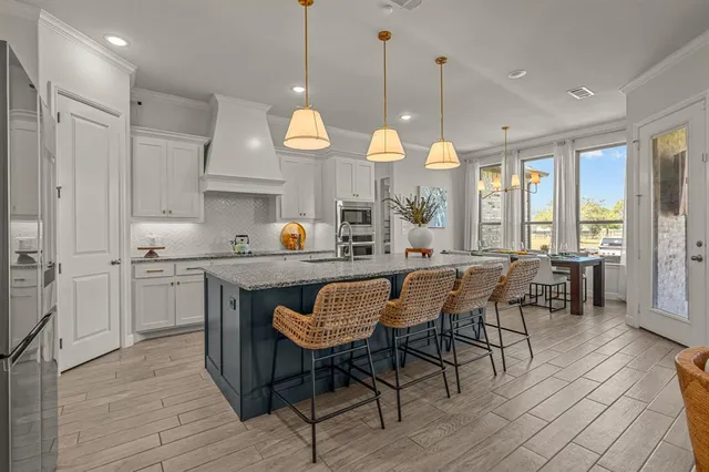 a kitchen with a table and chairs in it