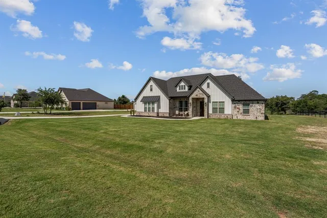 a view of a house with a big yard