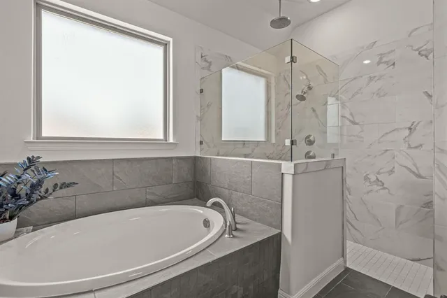 a view of walk in closet with clothes