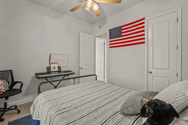 a bedroom with a bed and a window