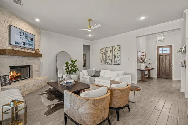 a living room with furniture and a fireplace