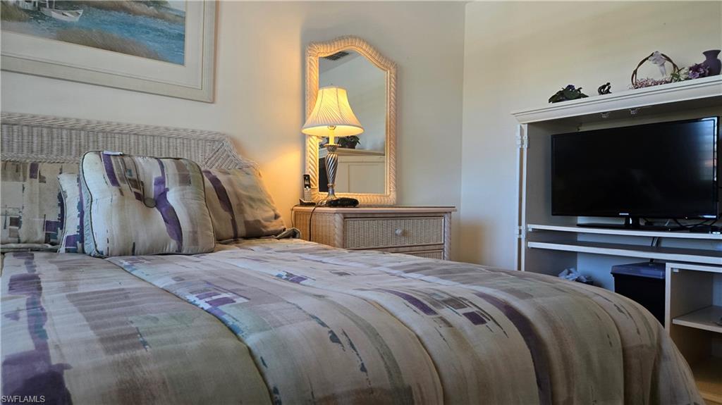4580 Andover Way, Unit 305B Naples, FL 34112 - Photo 16 of 32 Guest bedroom with its own TV for your guests