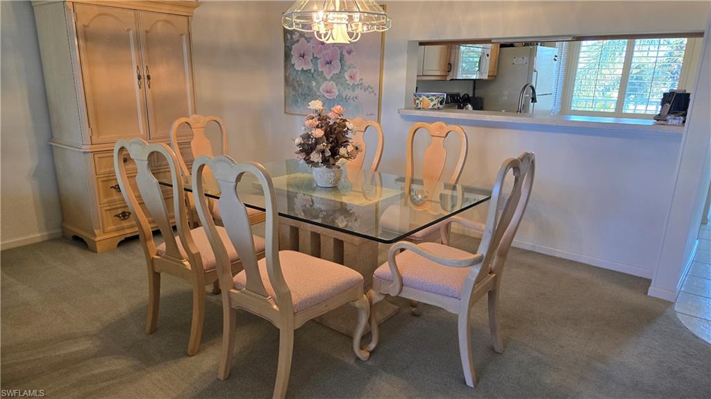 4580 Andover Way, Unit 305B Naples, FL 34112 - Photo 6 of 32 Dining area open to kitchen and breakfast bar for easy entertaining