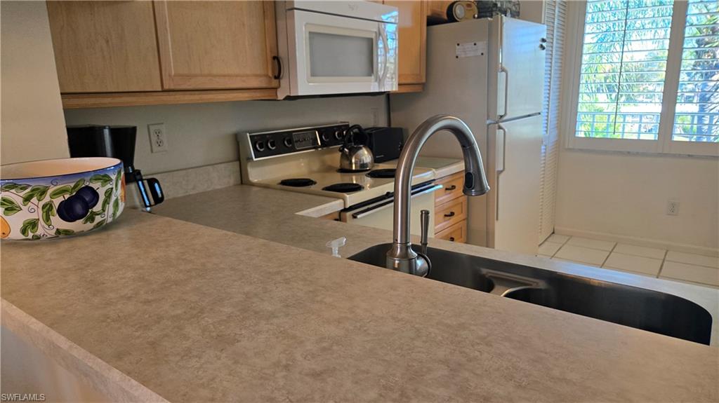 4580 Andover Way, Unit 305B Naples, FL 34112 - Photo 10 of 32 Plenty of counter space for serving your guests