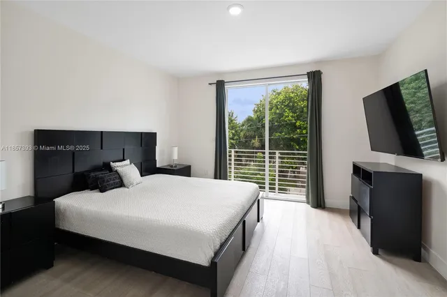 a view of kitchen with sink and cabinets
