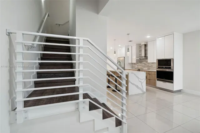 a view of balcony with wooden floor and fence