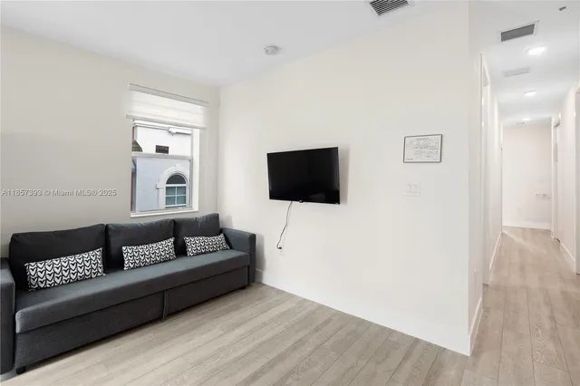 a living room with furniture and a window