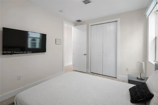 a bathroom with a shower a toilet and a sink