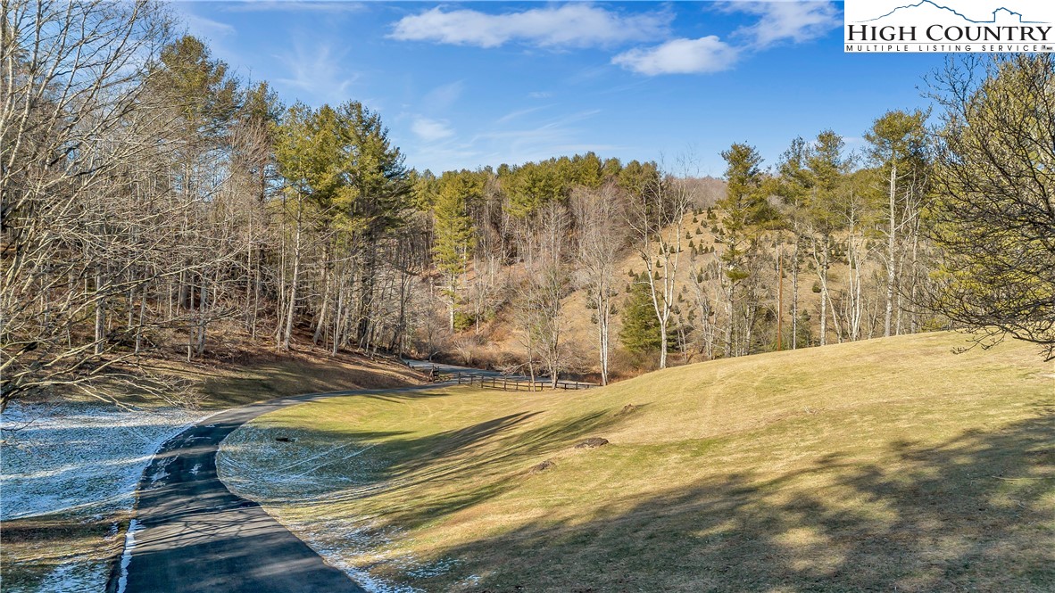 1324 Ripshin Road Troutdale, VA 24378 - Photo 15 of 47 a view of a swimming pool with an outdoor space and seating area