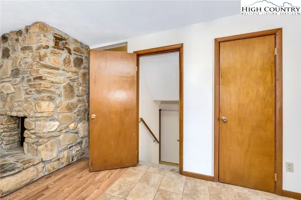 a kitchen with granite countertop a stove and a wooden floor