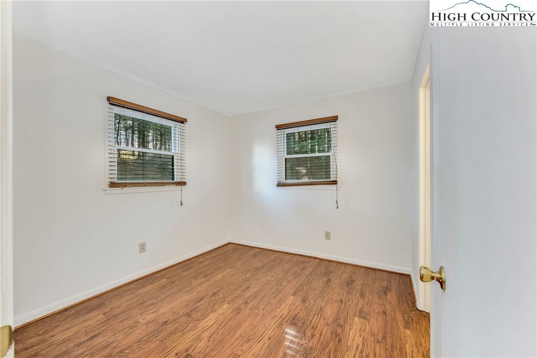 1324 Ripshin Road Troutdale, VA 24378 - Photo 26 of 47 an empty room with a window and wooden floor