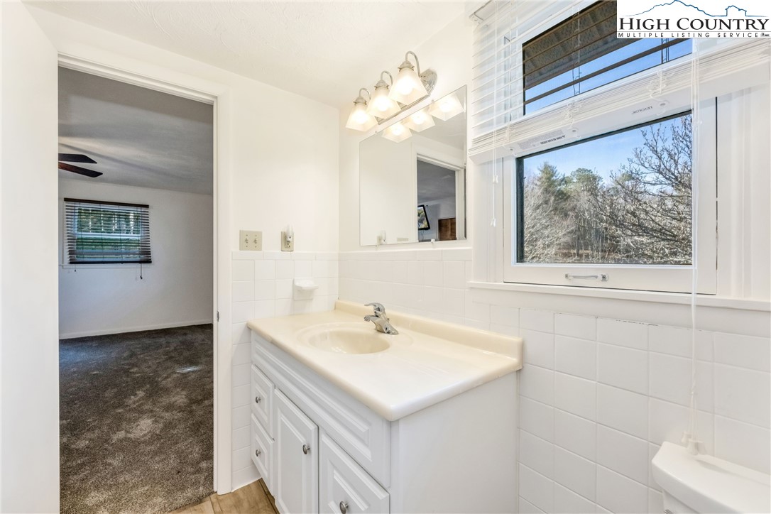 1324 Ripshin Road Troutdale, VA 24378 - Photo 34 of 47 a bathroom with a sink and a mirror