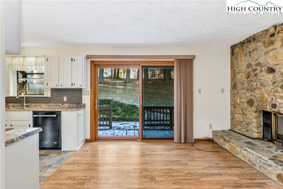 1324 Ripshin Road Troutdale, VA 24378 - Photo 36 of 47 a view of a kitchen with a sink a fireplace and a window