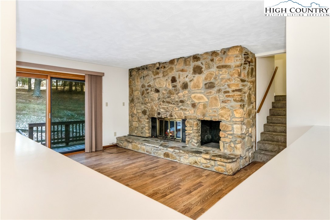 1324 Ripshin Road Troutdale, VA 24378 - Photo 39 of 47 a living room with a fireplace and a flat screen tv
