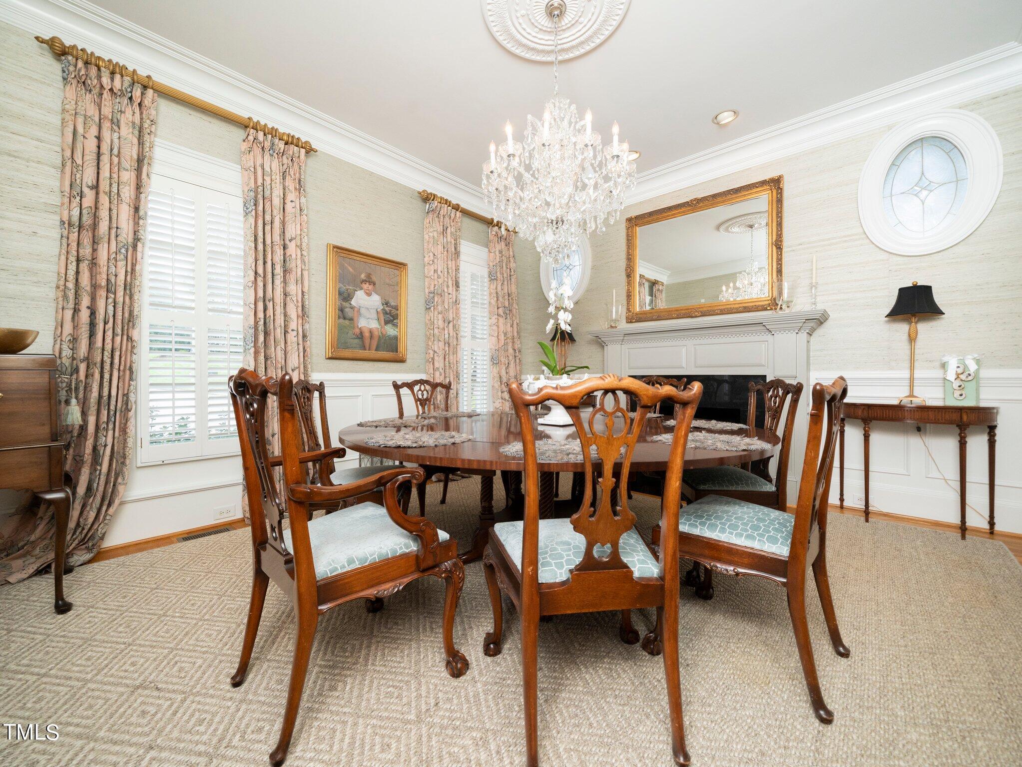 2512 Lewiswood Lane Raleigh, NC 27608 - Photo 11 of 41 a view of a dining room with furniture and chandelier