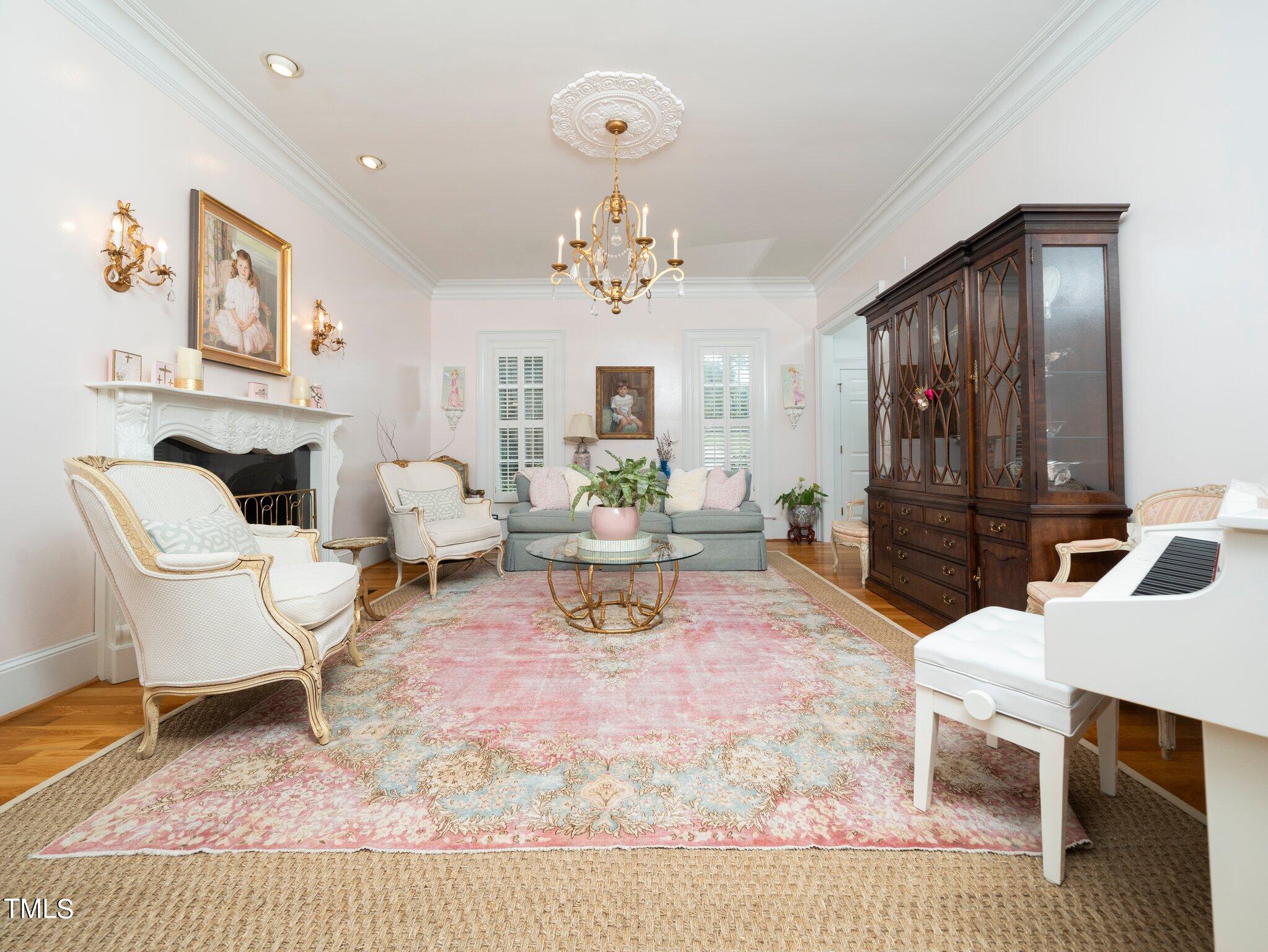 2512 Lewiswood Lane Raleigh, NC 27608 - Photo 14 of 41 a living room with furniture and a chandelier