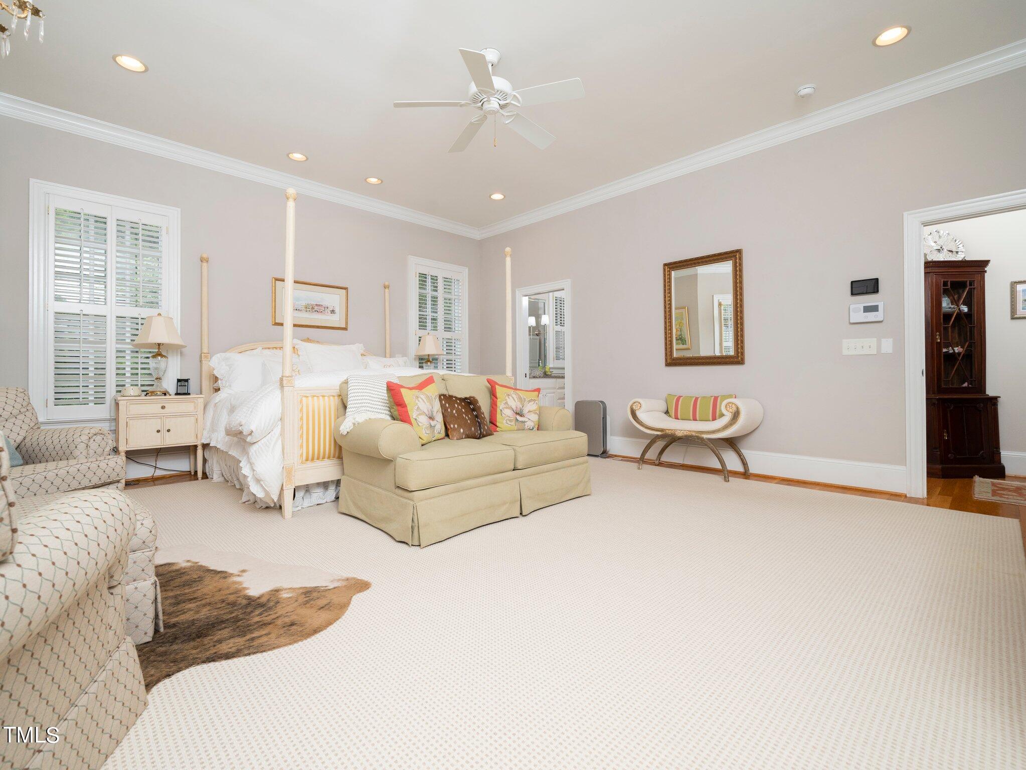 2512 Lewiswood Lane Raleigh, NC 27608 - Photo 17 of 41 a bedroom with furniture and a couch
