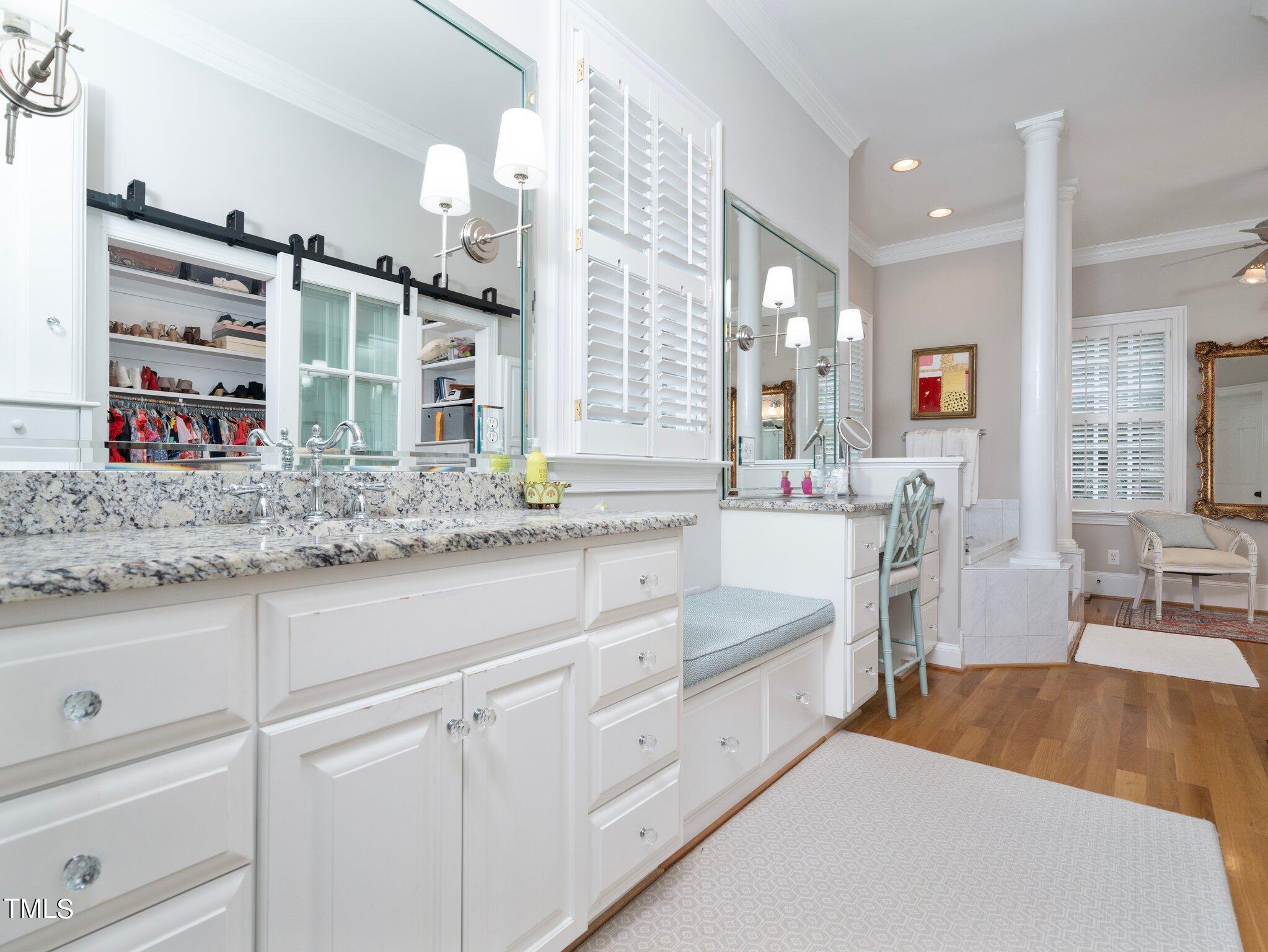 2512 Lewiswood Lane Raleigh, NC 27608 - Photo 18 of 41 a spacious bathroom with sinks mirror and a bathtub
