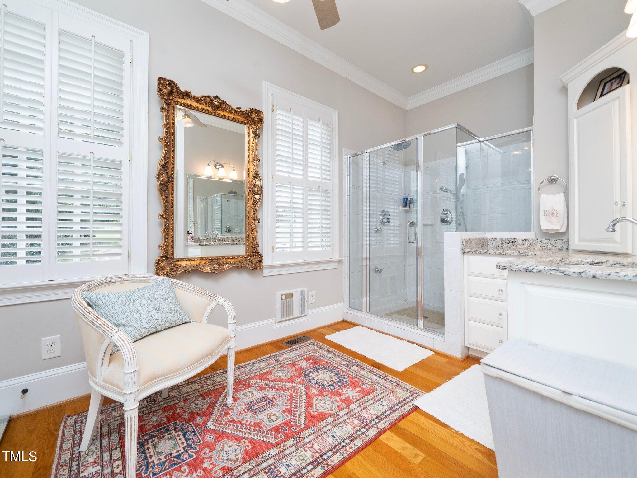 2512 Lewiswood Lane Raleigh, NC 27608 - Photo 20 of 41 a spacious bathroom with a tub sink and mirror