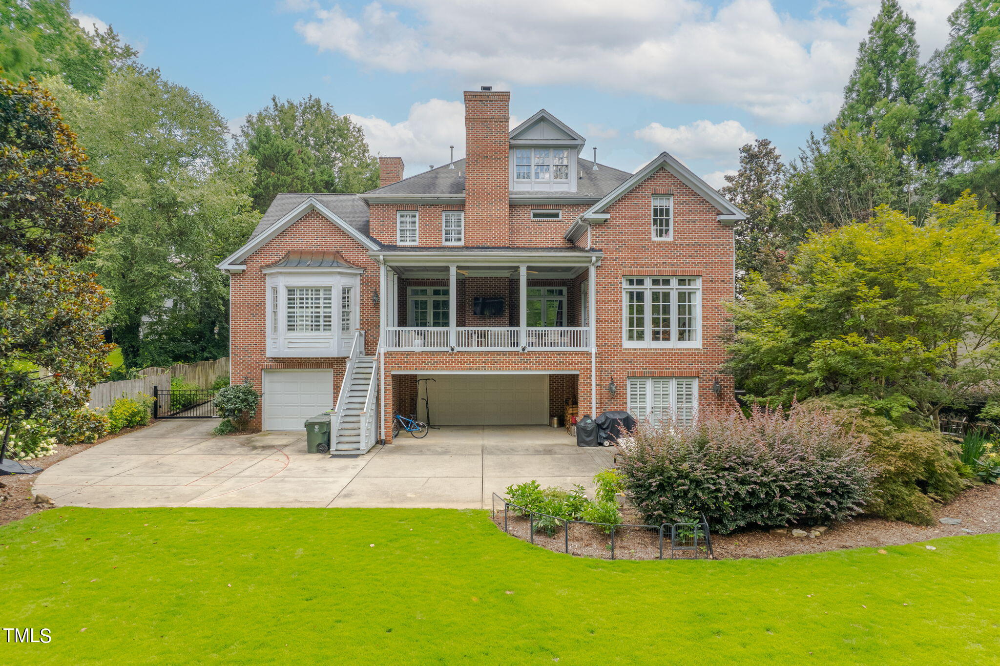 2512 Lewiswood Lane Raleigh, NC 27608 - Photo 2 of 41 a front view of a house with a yard and trees