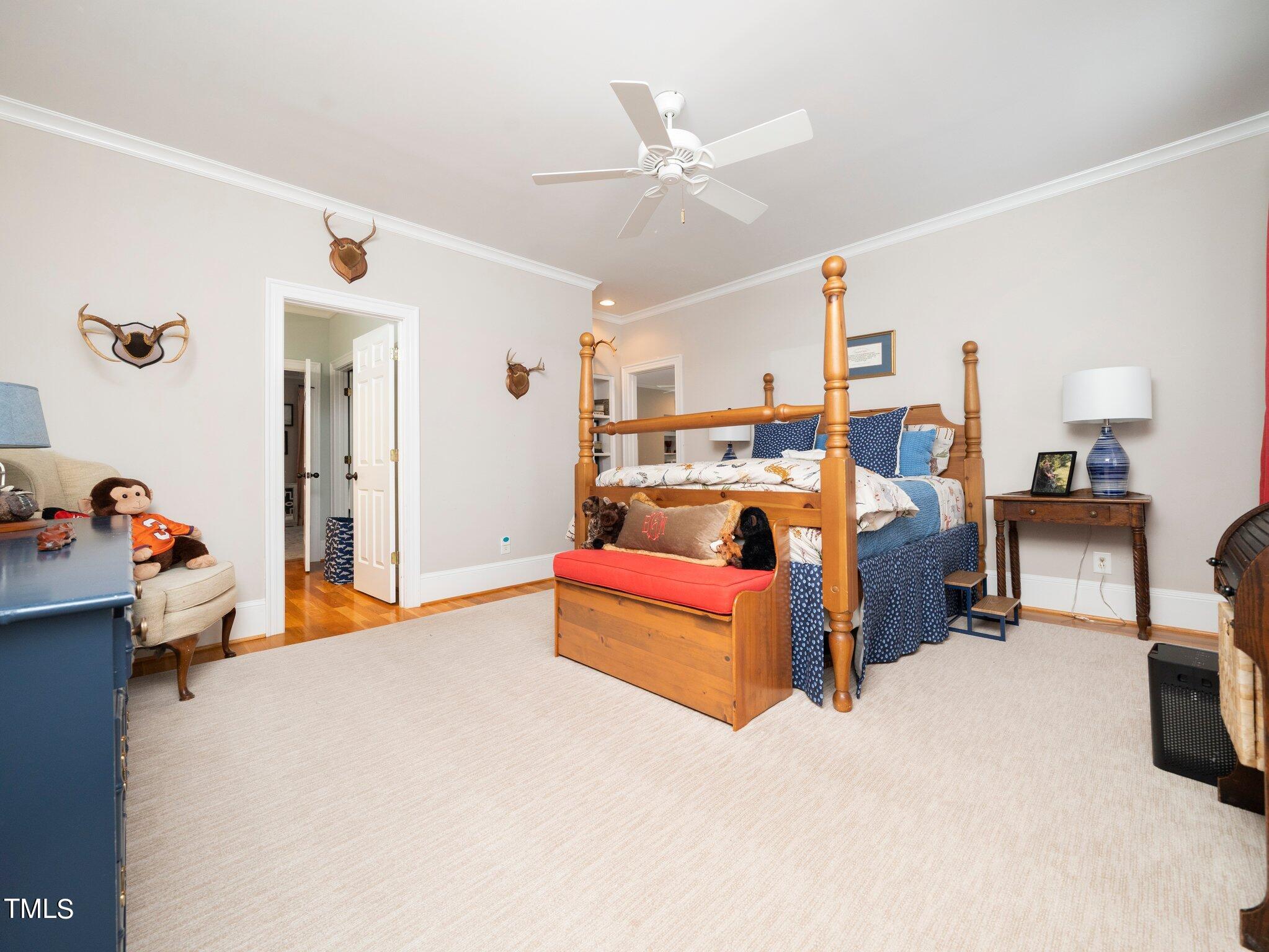 2512 Lewiswood Lane Raleigh, NC 27608 - Photo 25 of 41 a bed room with furniture and a chandelier
